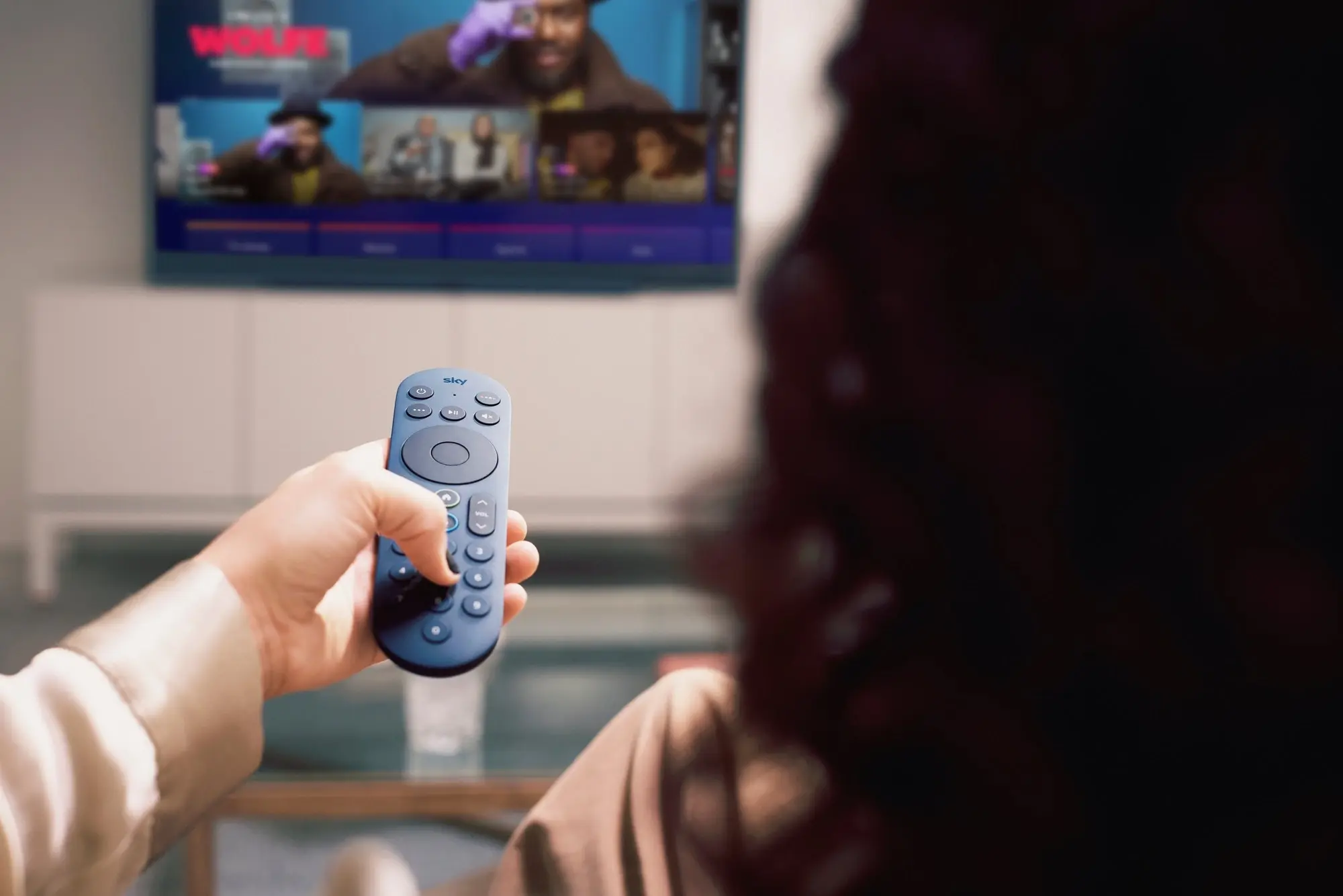 Sky_holding_remote.webp